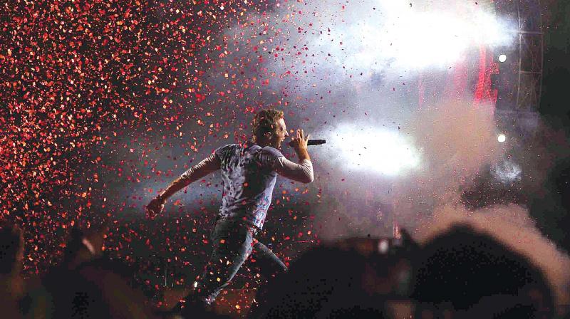 As many as 80,000 fans attended the much-awaited Coldplay concert at the swank Bandra-Kurla Complex in Mumbai on Saturday, where band frontman Chris Martin played their most memorable tracks - Fix You, Paradise, A Sky full of stars, The Scientist, A head full of dreams, Clocks, Parachutes and Viva la Vida, with a full complement of Bollywood stars  (Photo: DC)