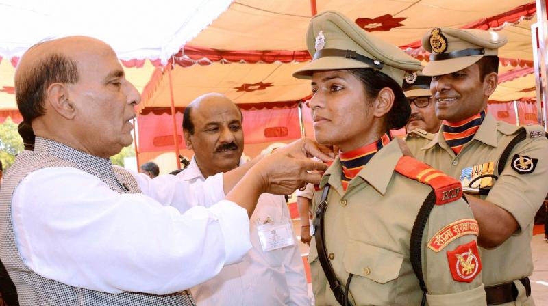 Union Home Minister Rajnath Singh pinning stars on the shoulders of a cadet during passing out parade at Border Security Force (BSF) Academy, Tekanpur, Gwalior. (Photo: PTI)