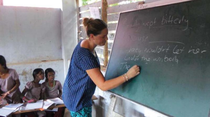 A foreigner teaching English to children of state schools under knowledge exchange programme in Alappuzha.  (File pic)