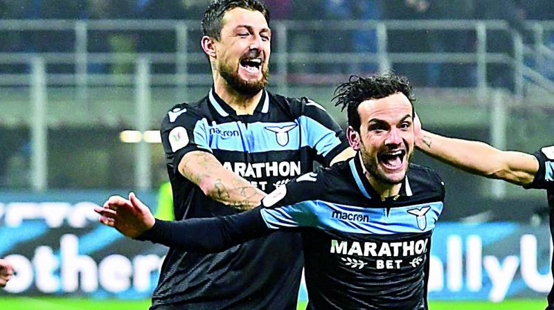 Lazios Italian defender Francesco Acerbi (right) celebrates with teammates after scoring the final penalty in the shootout of the Italian Cup match against Inter Milan at the San Siro stadium in Milan on Thursday.  (Photo: AFP)