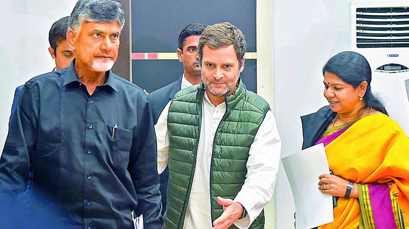 TD chief N. Chandrababu Naidu, Congress president Rahul Gandhi and DMK leader Kanimozhi leave after a press conference following a meeting of the opposition parties over various political issues including the issue of EVMs, in New Delhi on Friday.  (Photo:PTI)