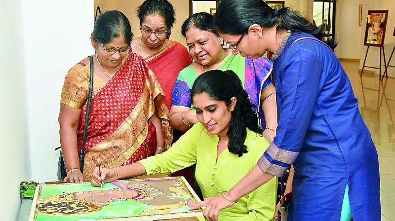 In action: Artists learn Tanjore Painting at the workshop.