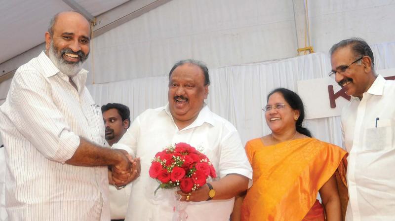 Water resources minister Mathew T. Thomas congratulates Thomas Chandy after the swearing-in ceremony at Raj Bhavan on Saturday. Chandys wife Mercy Chandy and former minister A. K. Saseendran look on. 	(Photo: A.V. MUZAFAR)