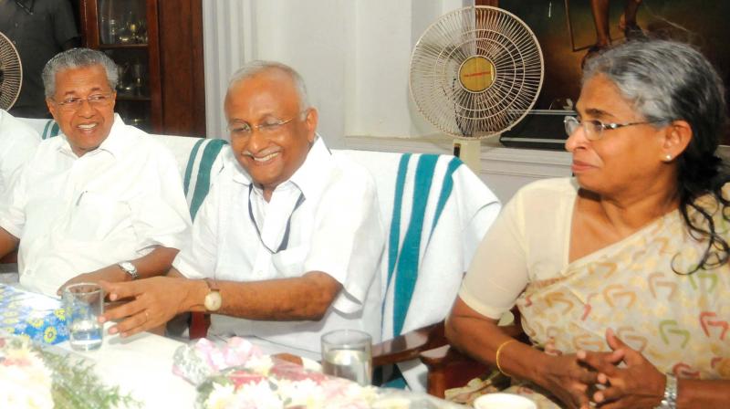 Chief Minister Pinarayi Vijayan greets chief secretary S.M. Vijayanand and additional chief secretary Sheela Thomas  at  the farewell function last week. 	 DC File