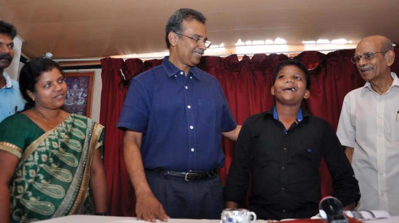 11-year-old Abhaya Kumar who underwent complex face reconstruction surgery five years ago with father Vijayakumar, mother Sheela, surgeon Dr Jayakumar and Dr Rajappan at Specialist Hospital in Kochi on Saturday. (Photo: DC)