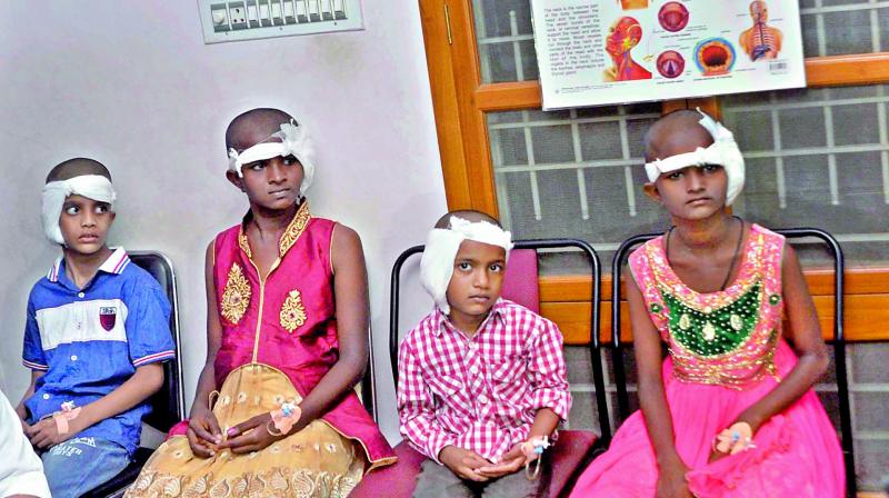 Sk. Tanvir Ahmed, Deepthi, Bala Tripura Sundari after undergoing cochlear implant surgery in Guntur on Tuesday. (Photo: DC)