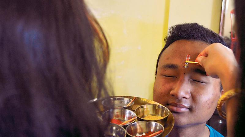 On the day of the five-day Tihar festival, Nepalis  celebrate the bond between siblings for their well-being 	 (Image DC)