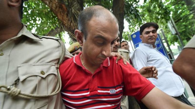 Accused Army Major Nikhil Rai Handa being taken by police to be produced at Patiala Court, after his arrest in relation with the alleged murder of a fellow army Majors wife. (Photo: PTI)
