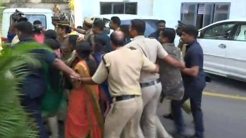 Five BJP Mahila Morcha members protesting against 2 women entering Sabarimala Temple today, stopped from entering the state secretariat by police in Thiruvananthapuram. (Photo: ANI)