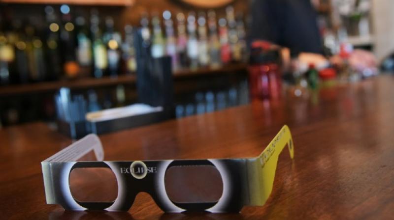 A pair of solar eclipse glasses are seen for sale at a restaurant ahead of the total solar eclipse in Charleston, South Carolina, on August 20, 2017. (Photo: AFP)