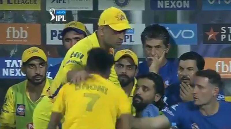 The fan bowed down to touch the CSK skippers feet and it took a few moments before a security guard interrupted and escorted the young boy out of the area. (Photo: BCCI/Screengrab)
