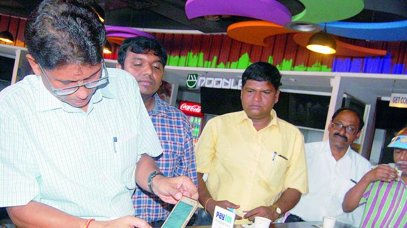 Divisional Railway manager Mukul Saran Mathur launched Digi-Pay services at the Visakhapatnam railway station on Wednesday. (Photo: DC)