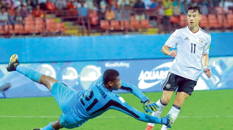 Germanys Nicolas Kuhn scores against Guinea in their Fifa U-17 World Cup Group C match at the Jawaharlal Nehru Stadium in Kochi on Friday. Germany won 3-1. (Photo: ARUN CHANDRA BOSE)