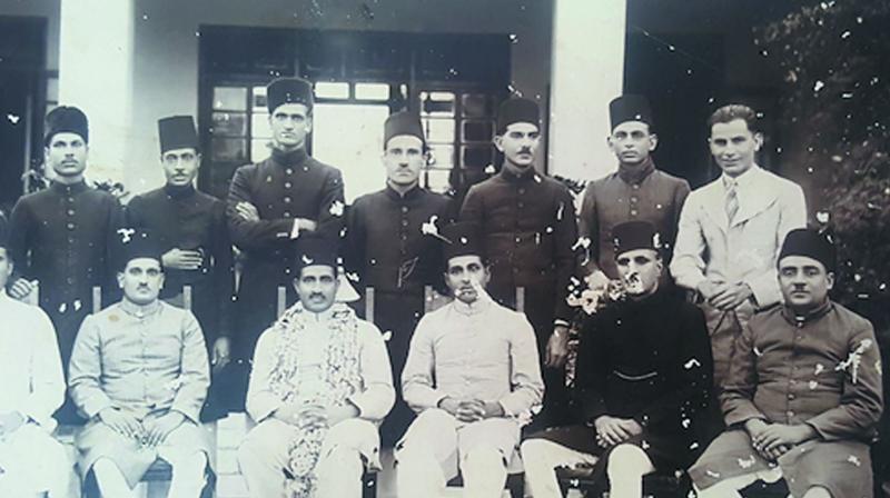The writers father (standing third from left) who joined the Hyderabad Revenue Service in the early 1930s had to perforce wear a sherwani and fez for all official functions. (Photo: File photo)