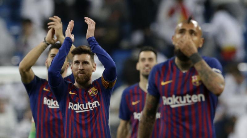 In the first of two consecutive games between the Spanish powerhouses at Santiago Bernabeu Stadium, Barcelona weathered a dominant first half by Madrid and then scored three times after the break for a 3-0 win Wednesday and a spot in the Copa del Rey final for a sixth straight season. (Photo: AP)