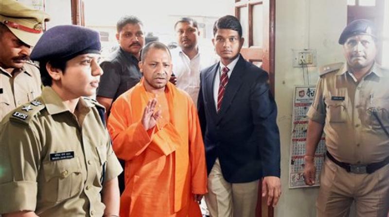 UP Chief Minister Yogi Adityanath during a surprise visit at the Hazratganj police station in Lucknow on Thursday. (Photo: PTI)
