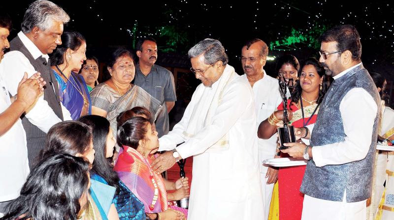 CM Siddaramaiah and MLA N.A. Haris felicitate women achievers from various fields during Womens Day organised by N.A. Haris Foundation at Cambridge Layout in Bengaluru on Saturday. (Photo:KPN)