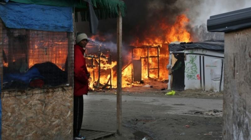 The fire broke out following a fight between rival groups of migrants. (Photo: AP)