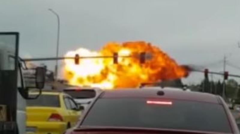 The aircraft, which cut the power lines and hit a traffic light pole, let out some sparks, exploded and burst into flames just before hitting the ground. (Photo: YouTube Videograb)