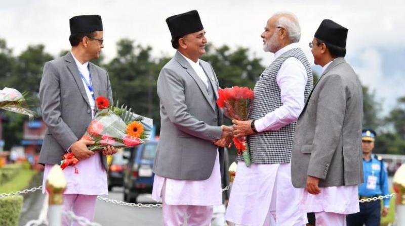 Prime Minister Narendra Modi being welcomed by dignitaries upon his arrival in Nepal. (Photo: Twitter | @PIB_India)