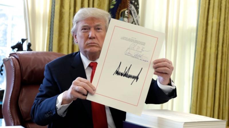 Trump told reporters that he was rushing through the signing of the bill to fulfil his promise to his fellow countrymen that he would do it before Christmas. (Photo: AP)