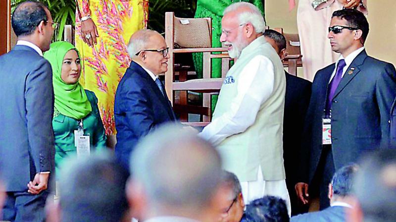 Prime Minister Narendra Modi shakes hands with Maldives former President Maumoon Abdul Gayoom during the swearing-in ceremony of President-elect Ibrahim Mohamed Solih in Male on Saturday. (Photo: PTI)