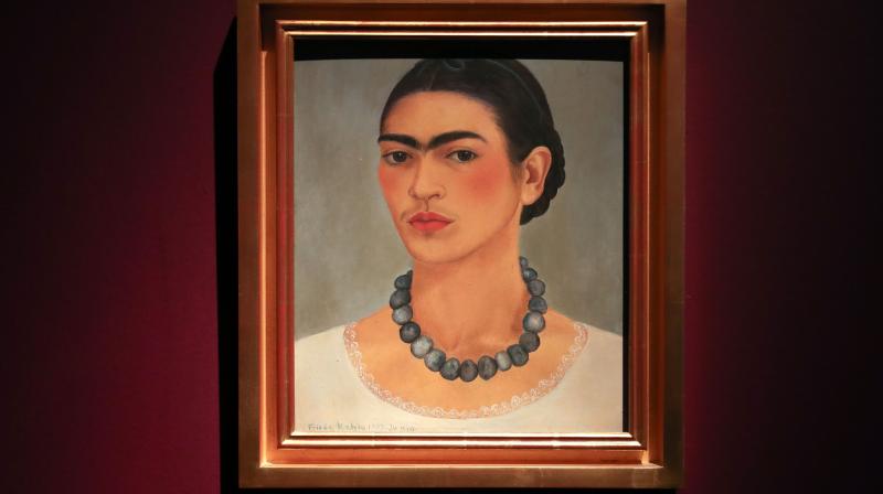 An artwork entitled Self-portrait with Necklace, by Frida Kahlo, 1933, Detroit and New York, USA, is displayed during an exhibition entitled Frida Kahlo: Making Her Self Up at the Victoria and Albert (V&A) Museum in west London on June 13, 2018.(Photo: AFP)