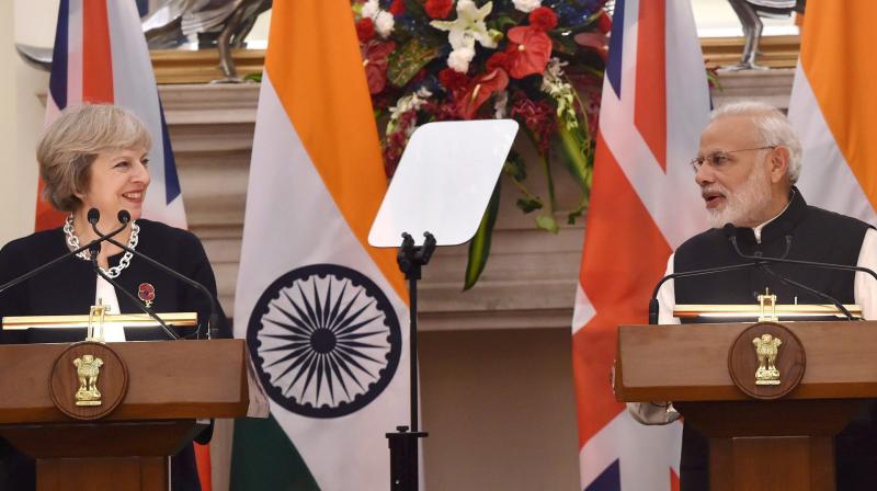 Prime Minister Narendra Modi and UK Prime Minister Theresa May during the joint statement at Hyderabad House in New Delhi. (Photo: PTI)