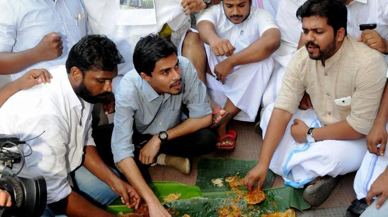 Youth Congress organised Beef Festivals in front of Ernakulam BJP office in Kochi on Saturday. (Photo: PTI)