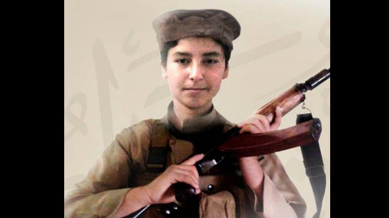 Isis media outlets published this image of Hudayfah al-Badri, son of the leader of Isis, Abu Bakr al-Baghdadi. (Photo: AP)