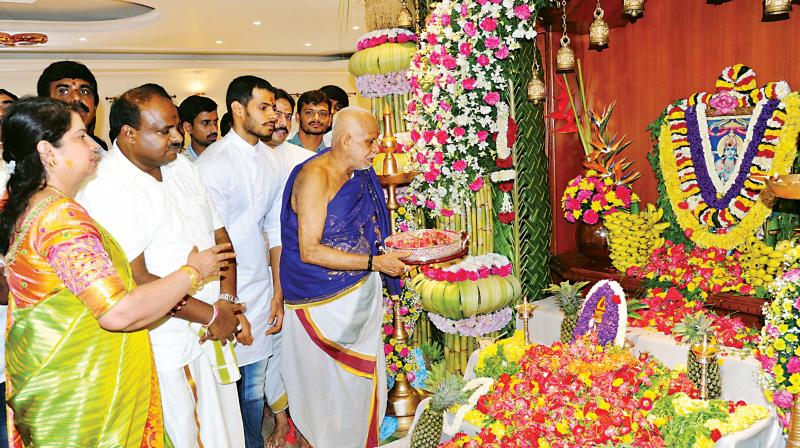 JD(S) state president H.D. Kumaraswamy  and wife Anitha conduct a pooja at the opening of their renovated house in JP Nagar in Bengaluru on Wednesday