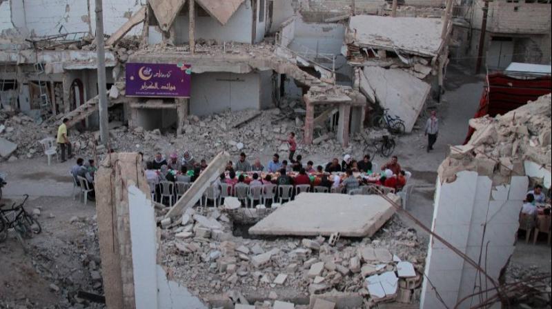 In pics: Ramadan meals among ruins in Syrias besieged Douma