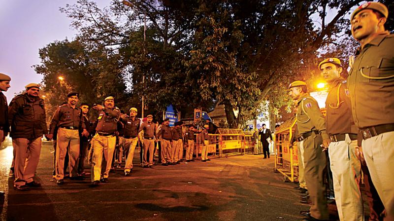 Policemen stand guard outside a Delhi court as Air Chief Marshal (retd) SP Tyagi was produced for questioning for allegedly influencing a $750 million deal with AgustaWestland 	(Photo: AP)