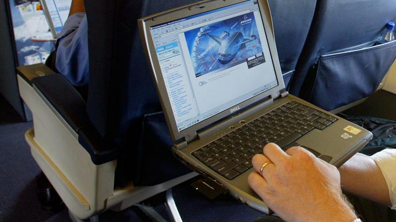 File photo of a laptop is used on a plane . (Photo: AP)