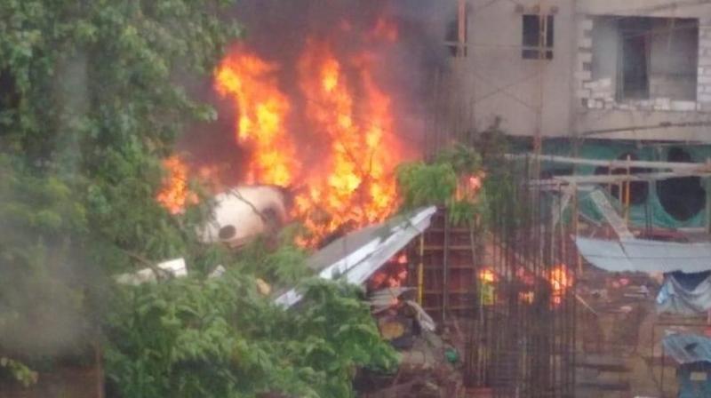 Chartered plane crashes in an open area in Mumbais Ghatkopar on Thursday. (Photo: Twitter | ANI)