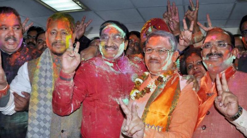 BJP in-charge for Uttarakhand, Shyam Jaju with Ramesh Pokhriyal Nishank celebrating the partys victory in Assembly elections in Dehradun. (Photo: PTI/File)