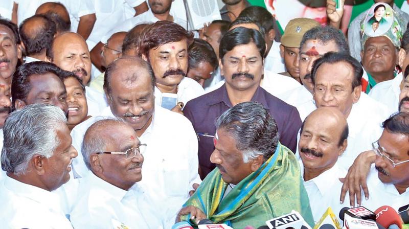 O. Paneerselvam introduces R.K. Nagar candidate,  E Madhusudanan at his residence on Thursday. (Photo: DC)