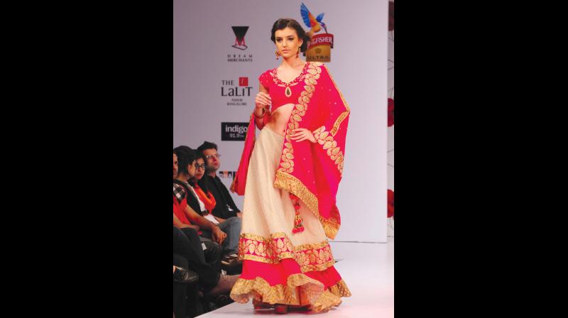 A city model sashays down the ramp in a stylish ruffled number.