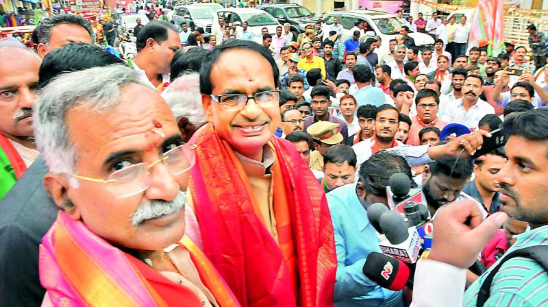 Madhya Pradesh Chief Minister Shivraj Singh Chouhan addresses a public meeting along with BJP candidate Banwari Lal at Ameerpet on Tuesday. 	 P. Surendra