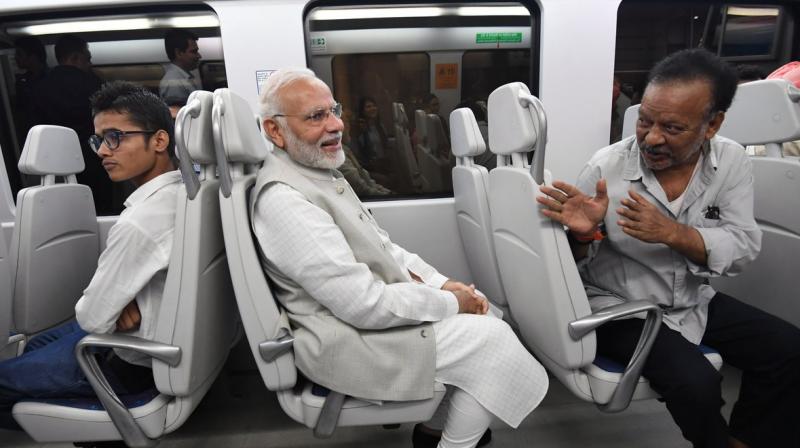 Prime Minister Narendra Modi on Thursday took a 14-minute ride in the Airport Express Metro from Dhaula Kuan to Dwarka to attend an event. (Photo: Twitter | @narendramodi)