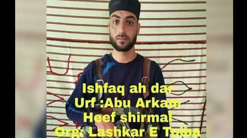 A purported picture of a Jammu and Kashmir policeman with an AK-47 assault rifle is doing the rounds of social media fuelling rumours that he has joined the Lashkar-e-Taiba (LeT) as he did not report for duty following a leave. (Screengrab)