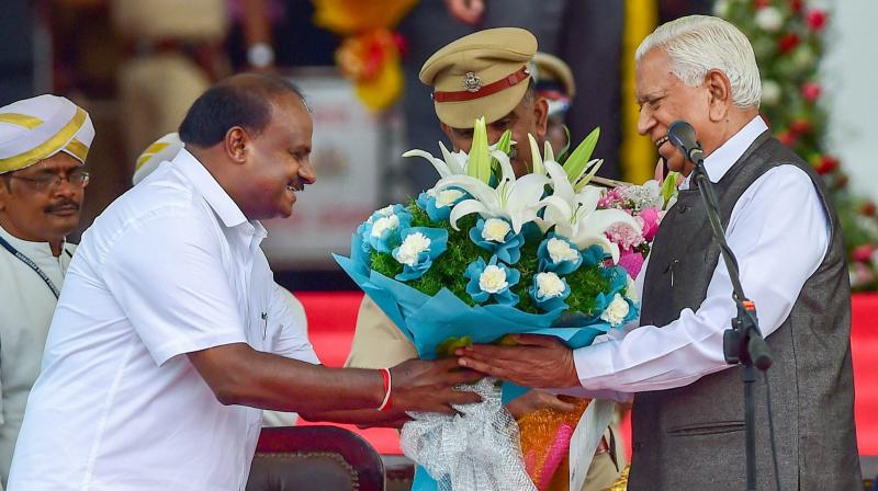 H D Kumaraswamy was administered the oath of office and secrecy by Governor Vajubhai Vala at a grand ceremony in the Vidhana Soudha complex. (Photo: PTI)
