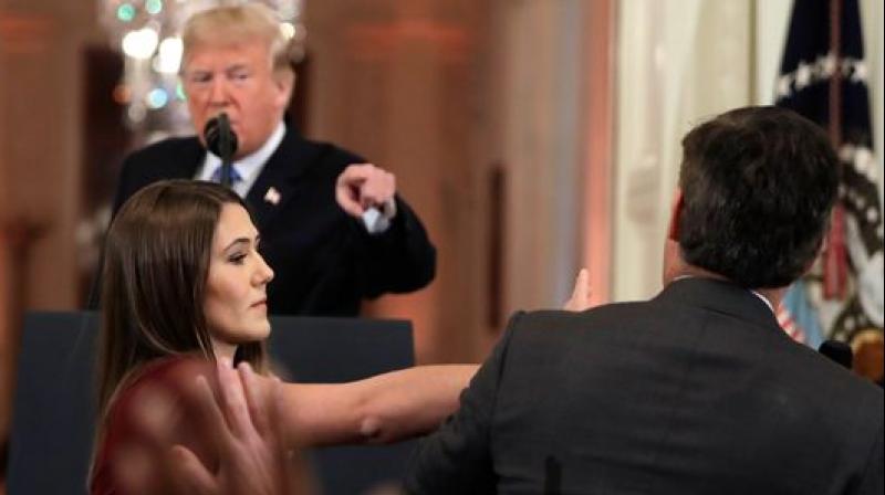 White House press secretary Sarah Huckabee Sanders released a statement accusing Jim Acosta of placing his hands on a young woman just trying to do her job as a White House intern,\ calling it \absolutely unacceptable.\. (Photo: AP)