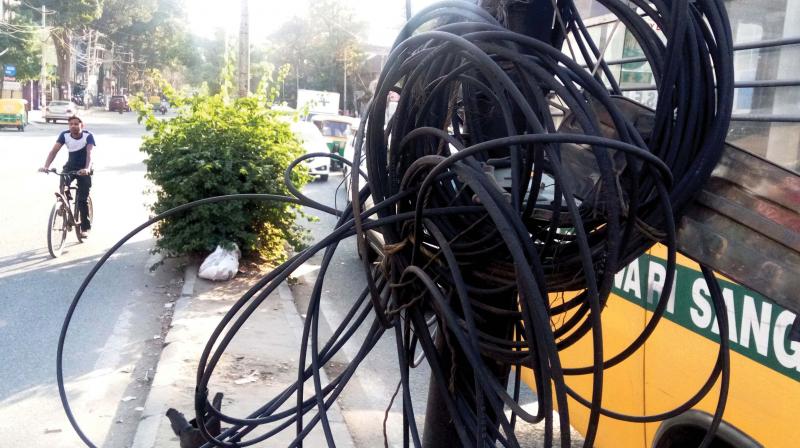 If the illegal cables slung over trees and walls are a danger to people and bikers, they are also costing the BBMP revenue as it is deprived of the fee due to it for laying of OFC cables underground.