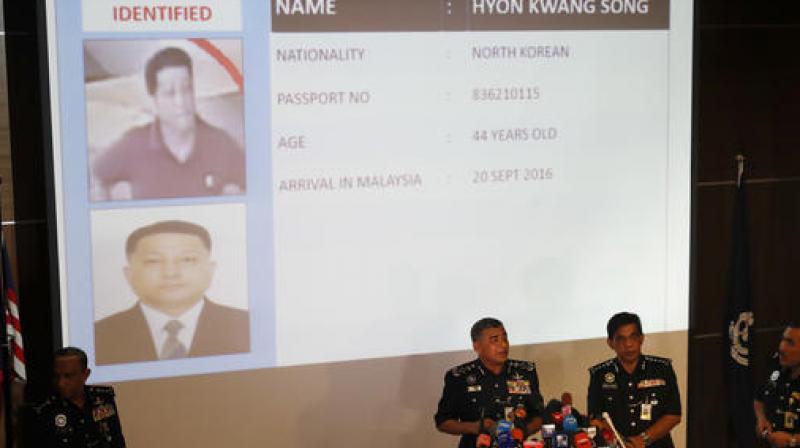 Malaysias Inspector-General of Police Khalid Abu Bakar, center left, speaks in front of the details of one of the suspects Hyon Kwang Song. (Photo: AP)