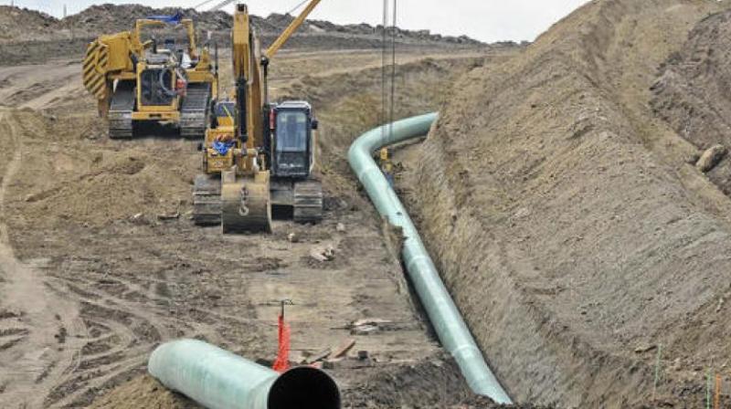 A Dallas-based developer is finishing the last big section of the pipeline, which will carry oil from North Dakota through the Dakotas and Iowa to a shipping point in Illinois.