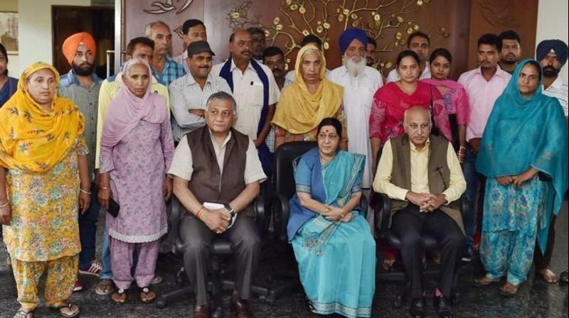 External Affairs Minister Sushma Swaraj, minister of state MJ Akbar and VK Singh with the families of 39 Indians killed in Iraq. (Photo: PTI/File)