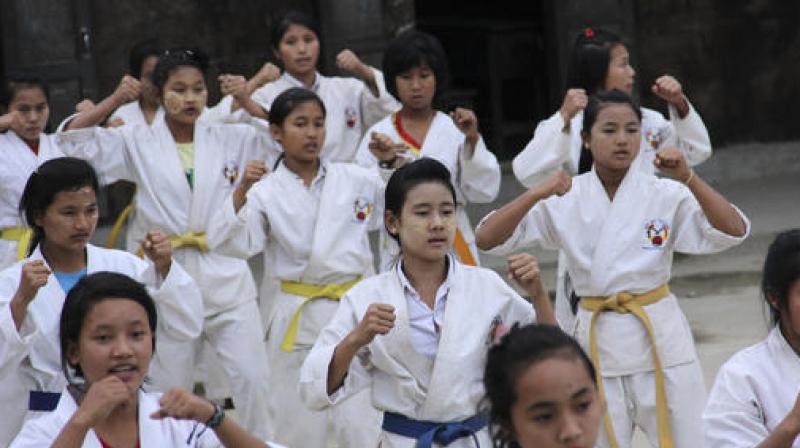 Internally displaced girls in Jeyang village camp, near the China border, join the karate training for self-defense in Kachin state, Myanmar. (Photo: AP)