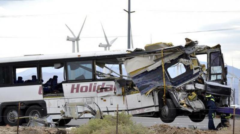 The front of the bus crumpled into the semi-trucks trailer and debris was scattered across the key route through Southern California. (Photo: AP)