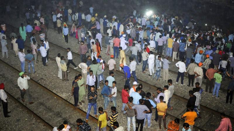 At least 61 people were killed and 72 injured Friday evening after a crowd of Dussehra revellers that had spilled onto railway tracks while watching burning of Ravana effigy was run over by a train near here, officials said. (Photo: PTI)